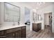Well-lit bathroom featuring dual vanities and modern fixtures with stylish finishes at 4803 S Ferric --, Mesa, AZ 85212