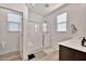 Bathroom featuring a glass-enclosed shower, tile surround, and modern fixtures at 4803 S Ferric --, Mesa, AZ 85212