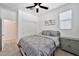 Well-lit bedroom with gray bedding, a ceiling fan, a closet, and neutral wall color at 4803 S Ferric --, Mesa, AZ 85212
