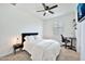Modern bedroom with carpet, a ceiling fan, a home office setup, and decorative lighting at 4803 S Ferric --, Mesa, AZ 85212
