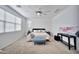 Serene bedroom featuring a ceiling fan, neutral tones, and plush carpeting at 4803 S Ferric --, Mesa, AZ 85212