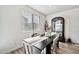 Stylish dining area with a modern black table and an elegant display cabinet at 4803 S Ferric --, Mesa, AZ 85212