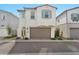 Charming two-story home featuring a brown two-car garage and manicured landscaping at 4803 S Ferric --, Mesa, AZ 85212