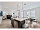 Open kitchen view with a breakfast bar that connects to the dining and living areas at 4803 S Ferric --, Mesa, AZ 85212