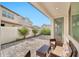 Covered patio features an outdoor seating area and views of the backyard landscaping at 4803 S Ferric --, Mesa, AZ 85212