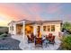 Beautiful backyard featuring a fire pit and patio seating area at 4946 N 210Th Ave, Buckeye, AZ 85396