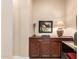 The space includes a buffet, dining table and interesting decorative pieces at 4946 N 210Th Ave, Buckeye, AZ 85396