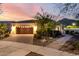 Charming single-story home with a well-maintained front yard and a spacious driveway leading to the garage at 4946 N 210Th Ave, Buckeye, AZ 85396