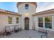 Stunning exterior view of the home showcasing its unique architectural design and turret-style entrance at 4946 N 210Th Ave, Buckeye, AZ 85396