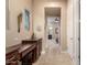Hallway with built-in desk and a window view to an adjoining bedroom and bathroom at 4946 N 210Th Ave, Buckeye, AZ 85396