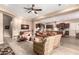 Spacious living room with open layout flowing into kitchen, perfect for entertaining at 4946 N 210Th Ave, Buckeye, AZ 85396