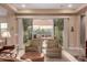 Cozy living space with sliding doors offering views of the outdoor patio and desert landscape at 4946 N 210Th Ave, Buckeye, AZ 85396
