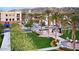 Town center featuring palm trees, green spaces, and inviting architecture at 4946 N 210Th Ave, Buckeye, AZ 85396