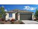 Charming single-story home with a neutral color palette, well-manicured landscaping, and a two-car garage at 4949 W Walatowa St, Laveen, AZ 85339