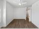 Spacious bedroom with ample light, neutral walls, modern ceiling fan, and vinyl floors at 5015 E Cheyenne Dr # 14, Phoenix, AZ 85044