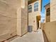 Exterior elevation with stucco walls, red tile roof, and energy-efficient air conditioning unit at 5015 E Cheyenne Dr # 14, Phoenix, AZ 85044