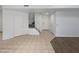 Hallway with staircase and multiple white doors, plus neutral flooring and lighting at 5015 E Cheyenne Dr # 14, Phoenix, AZ 85044