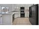 Updated kitchen featuring stainless steel appliances, quartz countertops and an eat-in bar at 5015 E Cheyenne Dr # 14, Phoenix, AZ 85044