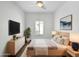 Cozy main bedroom with ample natural light, stylish decor, and comfortable king bed at 5015 E Cheyenne Dr # 14, Phoenix, AZ 85044