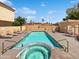 Community pool featuring lounge chairs, mature landscaping, and updated pool and spa at 5015 E Cheyenne Dr # 14, Phoenix, AZ 85044