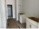 Bathroom area features a closet on the left and cabinets awaiting installation at 5634 W Olney Ave, Laveen, AZ 85339