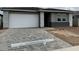 Charming single-story home with a spacious driveway and modern architectural design at 5634 W Olney Ave, Laveen, AZ 85339