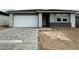Charming single-story home with a spacious driveway and modern architectural design at 5634 W Olney Ave, Laveen, AZ 85339