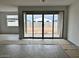 Bright living space with tile flooring and large sliding doors offering backyard views at 5634 W Olney Ave, Laveen, AZ 85339