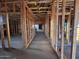 Interior view of wood framing, showcasing the skeleton of the new home's construction at 5638 W Olney Ave, Laveen, AZ 85339