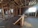 Interior wood framing and the start of HVAC and other systems in a new home at 5638 W Olney Ave, Laveen, AZ 85339
