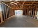 View of the interior wood framing of a modern home under construction with view to the rear yard at 5638 W Olney Ave, Laveen, AZ 85339
