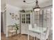 Bright dining area with modern lighting, white furniture, and decorative accents at 602 N May St # 65, Mesa, AZ 85201