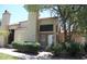 Inviting front exterior featuring a tile roof, chimney, and well-maintained landscaping at 602 N May St # 65, Mesa, AZ 85201