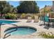 Community pool area featuring comfortable lounge chairs and a relaxing hot tub, perfect for outdoor enjoyment at 602 N May St # 65, Mesa, AZ 85201