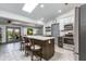 Modern kitchen with a spacious island and stainless steel appliances at 6031 E Inglewood St, Mesa, AZ 85205
