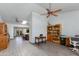 Open-concept living space with tile floors connecting to the kitchen at 6031 E Inglewood St, Mesa, AZ 85205