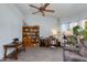 Spacious living room featuring a ceiling fan and natural light at 6031 E Inglewood St, Mesa, AZ 85205