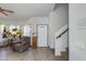 Bright living room with staircase and views of the front yard at 6031 E Inglewood St, Mesa, AZ 85205
