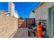 This area of the yard features a gate for access to the backyard and a concrete pad at 6031 E Inglewood St, Mesa, AZ 85205