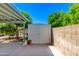 Exterior storage shed providing ample backyard storage space at 6031 E Inglewood St, Mesa, AZ 85205