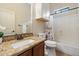 Bathroom with granite countertops, white cabinets and drawers, and a shower and tub combo at 6202 E Mckellips Rd # 65, Mesa, AZ 85215