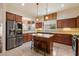 Well-equipped kitchen featuring an island with seating, granite countertops, and stainless steel appliances at 6202 E Mckellips Rd # 65, Mesa, AZ 85215