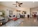 Open-concept living and dining area, offering tile floors, comfortable seating, and an abundance of natural light at 6202 E Mckellips Rd # 65, Mesa, AZ 85215