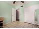 This bedroom features a spacious closet and natural light and neutral paint at 6416 S 19Th Pl, Phoenix, AZ 85042