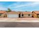 Charming single-story home with a well-manicured lawn and a two-car garage at 6416 S 19Th Pl, Phoenix, AZ 85042
