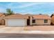 Inviting single-story home with a spacious driveway and easy-to-maintain landscaping at 6416 S 19Th Pl, Phoenix, AZ 85042