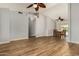 Open-concept living room featuring wood floors, vaulted ceilings, and smooth transition to dining at 6416 S 19Th Pl, Phoenix, AZ 85042