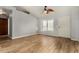 Bright living room with wood floors, neutral paint, high ceilings, and natural light at 6416 S 19Th Pl, Phoenix, AZ 85042