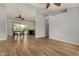 Inviting living room showcasing wood floors, open layout, and seamless flow to dining area at 6416 S 19Th Pl, Phoenix, AZ 85042