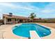 Back yard with a large in-ground swimming pool and diving board at 6416 S 19Th Pl, Phoenix, AZ 85042